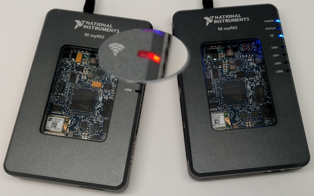 Photo of two myRIO devices, one with its orange ad-hoc wireless LED highlighted